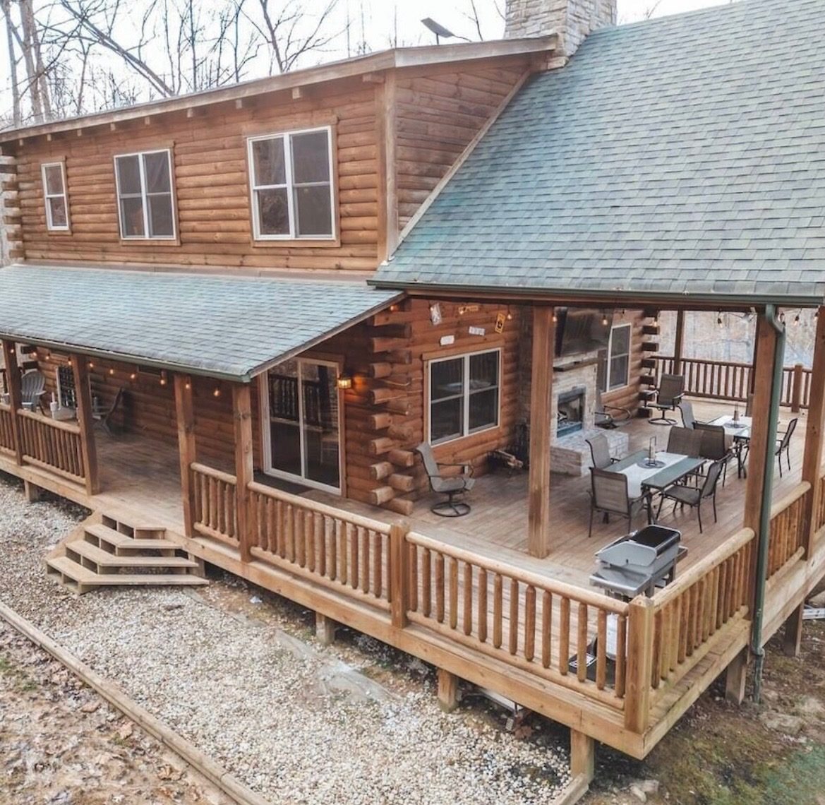 Golden Eagle Lodge exterior from above, showing the log home and wraparound covered deck