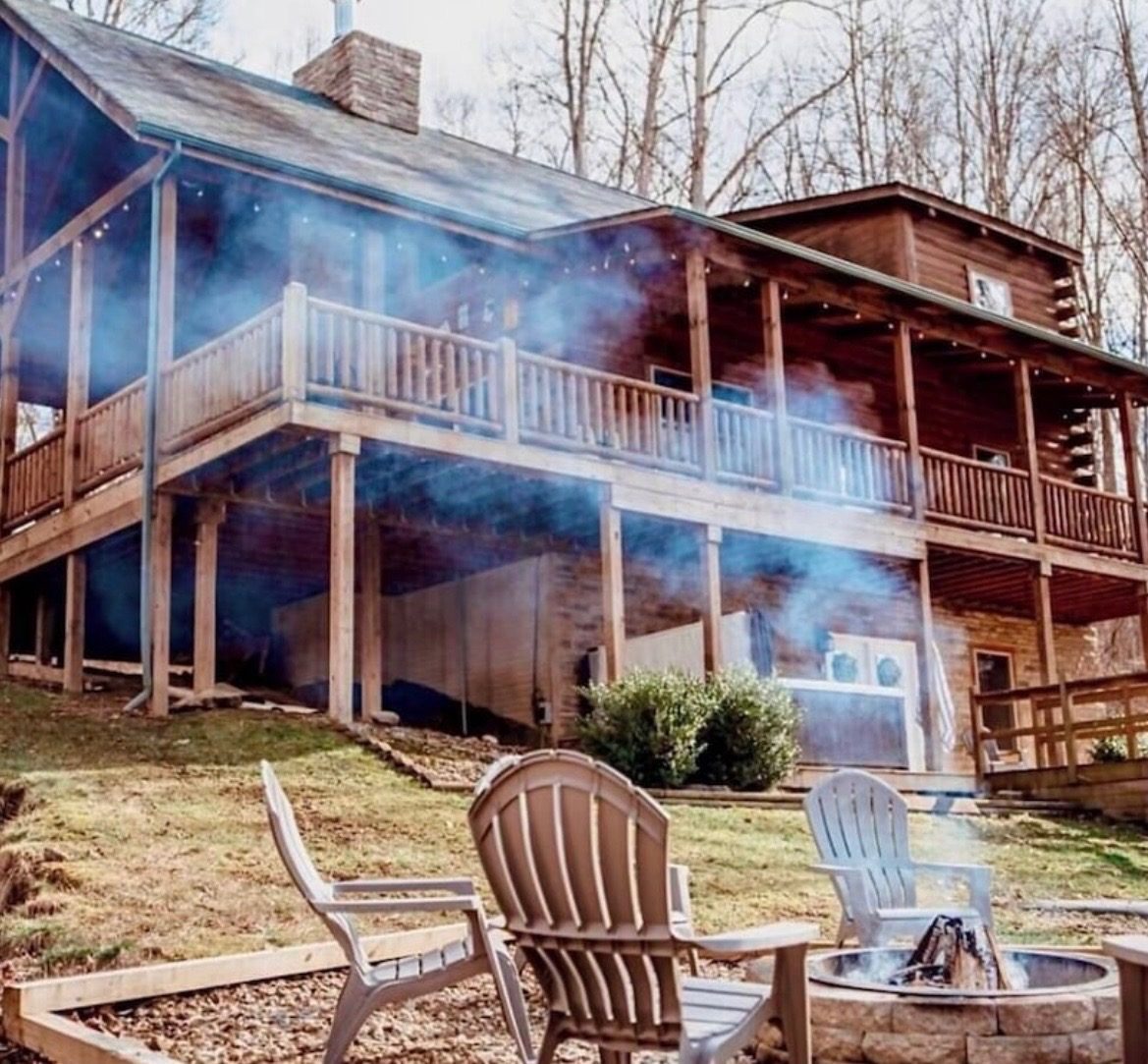Back of the lodge with the upper deck, seen across the fire pit