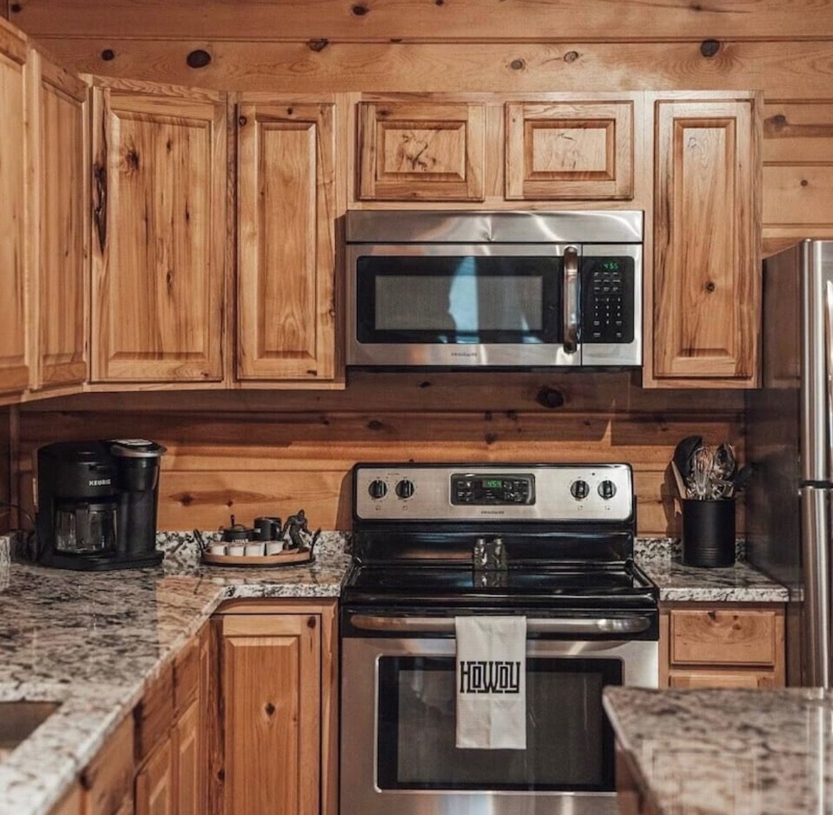 Kitchen with stainless stove, microwave and dual coffee maker