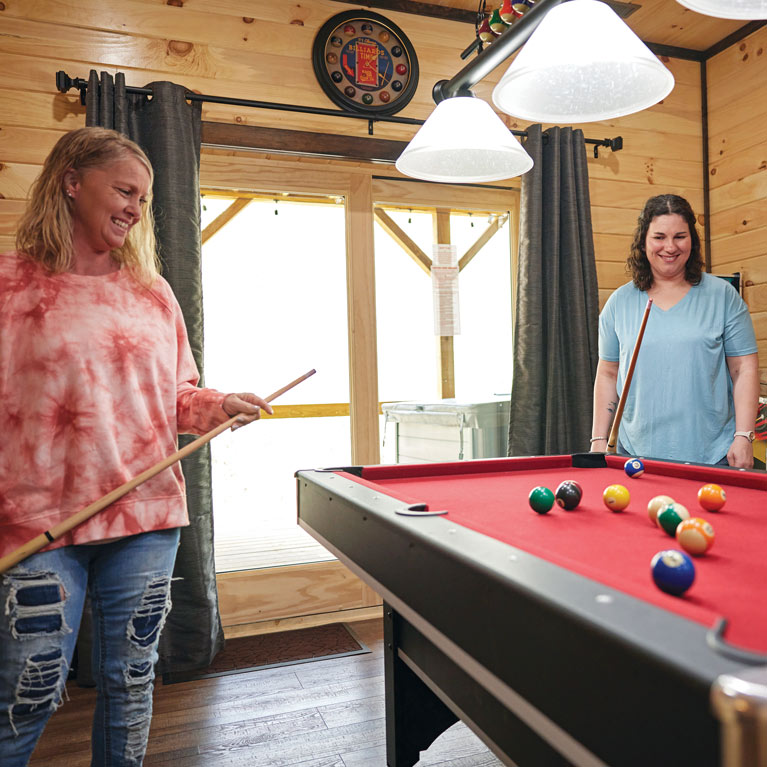 girls playing pool