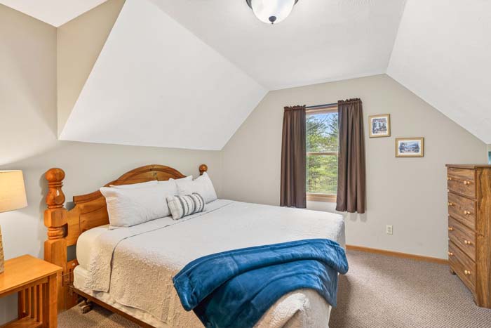 Entry level queen bedroom at cabin