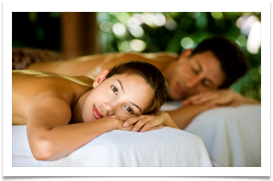 in cabin spa services lady and man laying on massage table